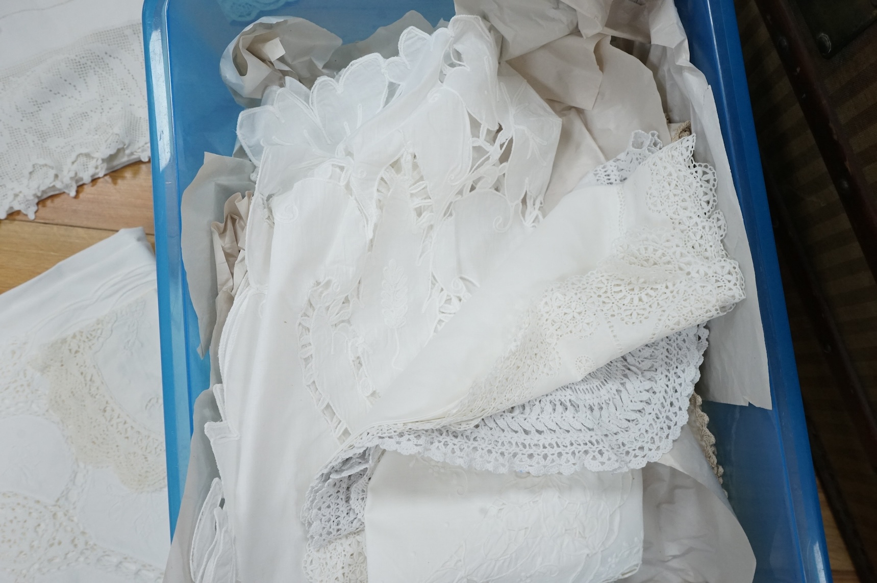 A collection of early 20th century and later crochet, cut work and drawn thread table linens and a large embroidered table cloth